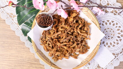 Pork is cut into pieces and then fried.