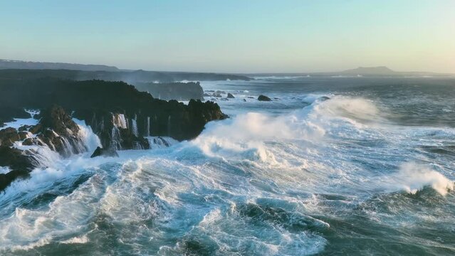 aerial slow motion view of ocean and giant waves crashing. Canary islands, Spain