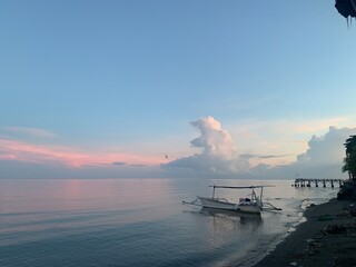 morning sun in Bali, Indonesia. Traditional fishing boats at Sanur Beach, Bali, Indonesia.