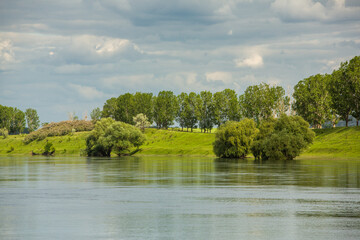 Beautiful summer landscape with green trees,  green meadows on the bank of the river in Republic of Moldova.
