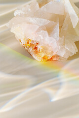 Luminous Quartz with Rainbow Flares. Sun's rays interact with quartz stone, iridescent rainbow glares, background with shining crystal at sunlight, aesthetic view with natural light effect