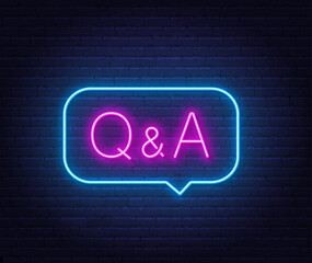 Q and A Neon Sign in speech bubble on brick wall background..