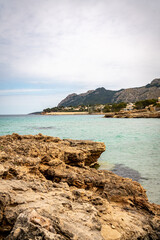 Rocky beach in the Victoria town in Mallorca Spain on a cloudy summer day