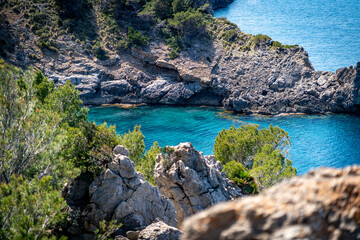 sea side shore in la victoria town in mallorca spain on a chilly day - blue waters and blue sky