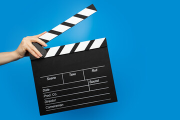 Obraz premium Hands with cinema board, clap entertainment, spectator tickets sale, discount.