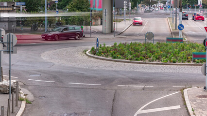 Street with road and cars timelapse at Platz der Vereinten Nationen in Modern City in Vienna in Austria.