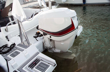 The rear part of a modern speedboat with an engine. Modern vessel.