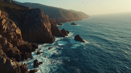 Aerial Drone Shot: Portuguese Rocky Shore with Beautiful Ocean View. Flying Over Portugal, Oceanic Waves Rolling, Crashing Into Cliffs. Lonely Fisherman Fishing. Praia Do Guincho.