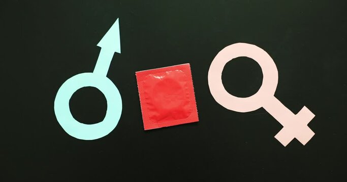 Love or sex icon of man and woman with condom. Relationship or gender differences concept