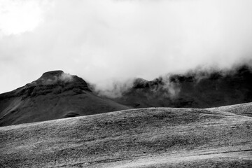Clouds starting to flow over the mountains in the Drakensberg Mountain range in South Africa, in...