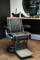 Stylish modern barber chair in the barbershop.