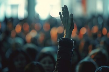 raised hand in blurred crowd at council meeting democracy concept photo