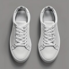 Minimal white sneakers on a solid grey background, perfect for showcasing custom shoe designs or fashion branding