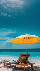 Sunny beach scene with yellow umbrella and chair