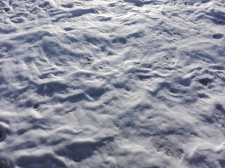 White foam of sea water waves as texture or background. Aerial view of water surface background, white foam of sea waves texture. Watersplashes as sea waves and foam background. Close-up of sea foam.