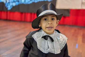 portrait of a Latin boy in his knight costume at a school event to celebrate the 9th of July, Argentina's Independence Day.