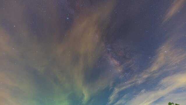 Time lapse Milky Way on a cloudy night. The long night saw the Milky Way begin to perpendicular to the sky. Clouds followed by, obscuring the sky and stars. The night sky sparkles with stars.