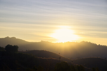 Morning time of panorama mountain under dramatic twilight sky and cloud. Nightfall Silhouette mountain on sunset.