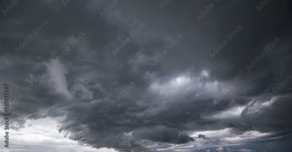Aufkleber The dark sky with heavy clouds converging and a violent storm before the rain.Bad or moody weather sky and environment. carbon dioxide emissions, greenhouse effect, global warming, climate change.
