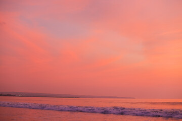 Beautiful peach sky at sunset over ocean