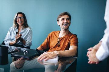 Successful business professionals meeting in a boardroom to discuss a project