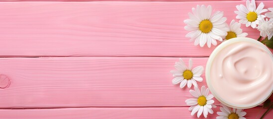 Cosmetic cream featuring a chamomile flower on a pink wooden background an ideal copy space image