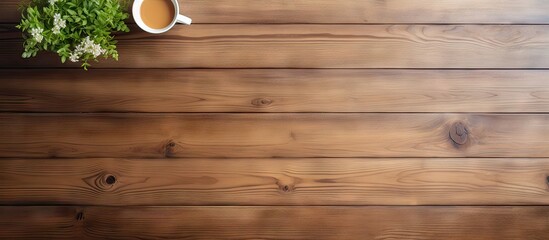 A top down view of a wooden desk in an office with a white sheet providing empty space for placing objects or taking photos. Copy space image. Place for adding text and design