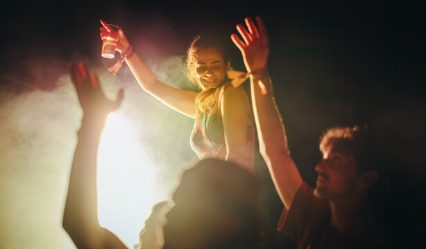 Young crowd celebrating with dance in the festival spirit