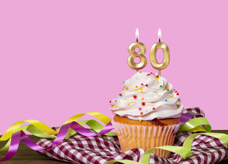 Birthday Cake With Candles Lit Forming The Number 80
