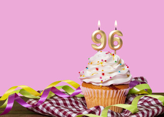 Birthday Cake With Candles Lit Forming The Number 96