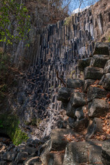 Basalt monolith columns wall in a deep gorge rock formation. Cascada Los Tercios, Suchitoto, El...