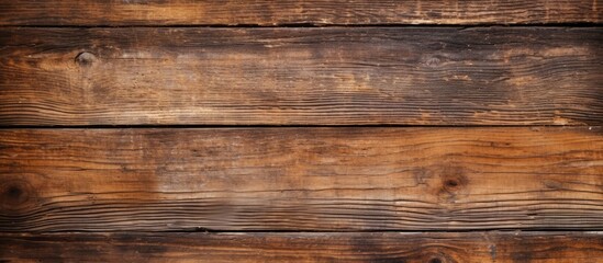 Obraz premium Aged brown wooden texture provides a captivating and rustic backdrop perfect for showcasing products or text in a copy space image