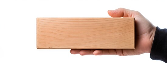 Close up copy space image of a wooden box being held by a man s hand against a white background