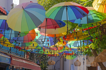 Fototapeta na wymiar Colourful Rainbow Umbrellas Parasols Over Street in Istanbul Turkey