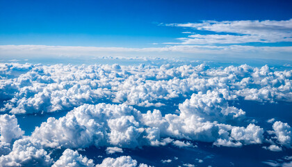 Fluffy white clouds blanket the sky with sun rays filtering through.