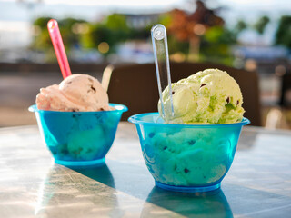 Ice cream cups with plastic spoons