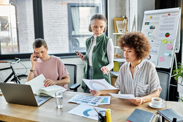 Hard working diverse businesswomen, including members of the LGBT community, working together in an office.