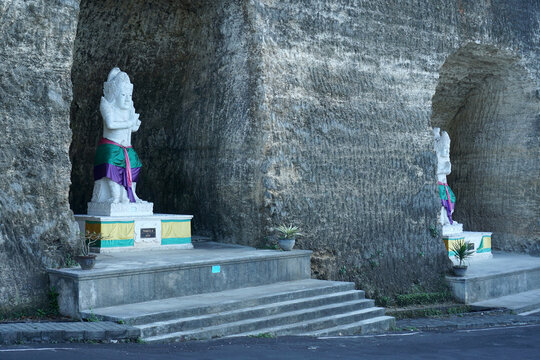 Nakula Sadewa statue on the cliff at Pandawa Beach, Bali                                                 
