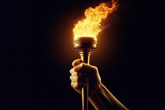 Glorious hand holds flaming torch isolated black background