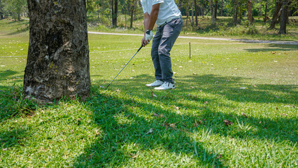 Golfer are playing game golf and hitting go on green grass mountain background.