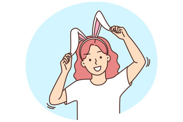 Smiling girl in bunny ears