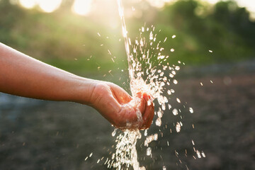 hand is holding a stream of water