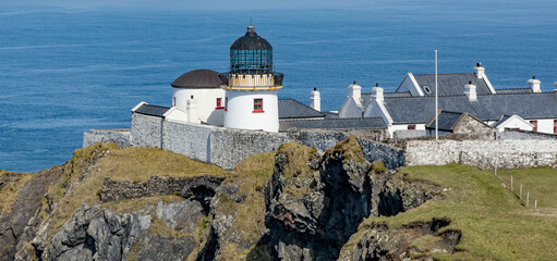 Overview of a lighthouse perched on a cliff