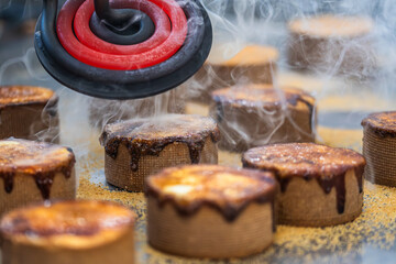 A tart is caramelized with a hot iron. Caramelization process.