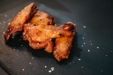 Chicken wings on black background