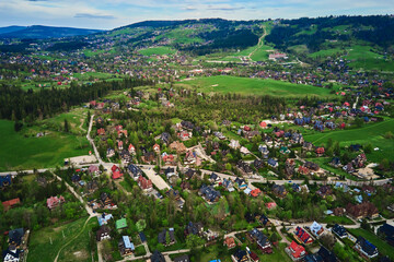 Aerial view of Tatra mountains and Zakopane town at morning. Panoramic landscape with mountain...