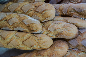 Baguettes made in a traditional way, preparing them to be sold in a bakery