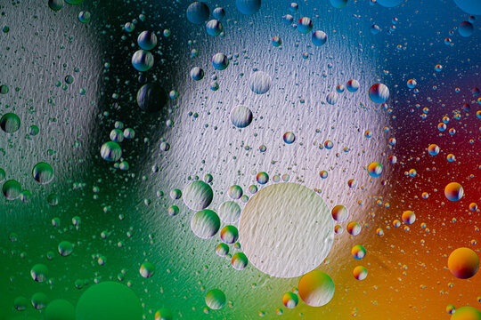 holiday light background. holiday postcard background. oil drops on the water surface