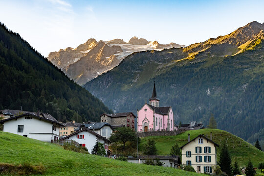 View of the peaks and the Pink Church of Trient in Switzerland