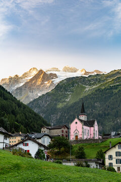View of the peaks and the Pink Church of Trient in Switzerland